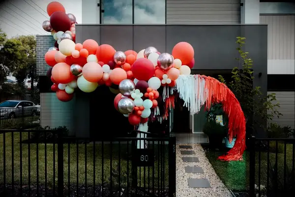 Orange balloon wedding reception installation