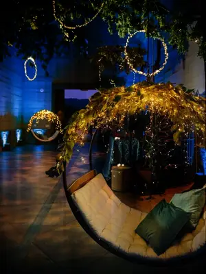 Hanging chairs with twinkle lights at reception