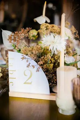 Natural dried botanical florals beside table number