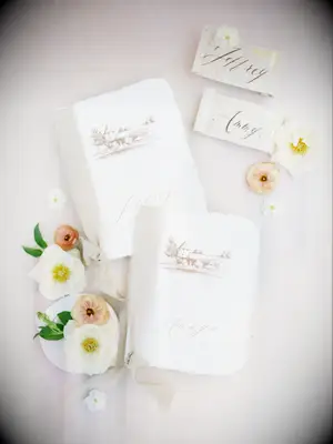 These pale neutral-colored wedding place cards are ideal for a spring-time celebration.