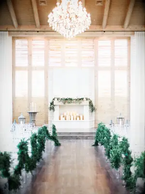 indoor wedding ceremony with fireplace at altar