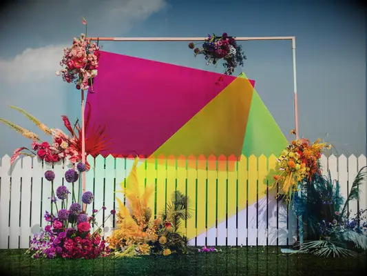 colorful wedding arch alternative with neon colored acrylic squares