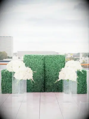 wedding arch alternative boxwood wall with white flowers