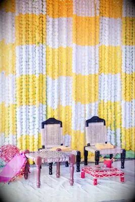 yellow-and-white haldi ceremony backdrop