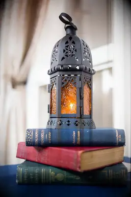 vintage lantern sitting on books