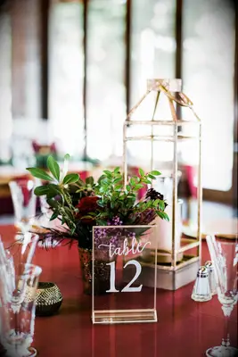 gold lantern and gold wedding table number