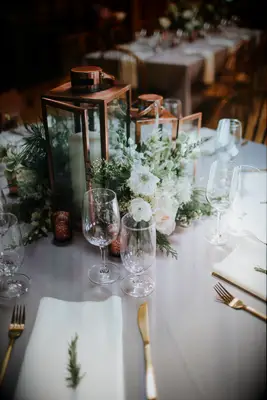 copper lantern filled with flowers