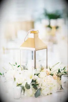gold lantern and white roses