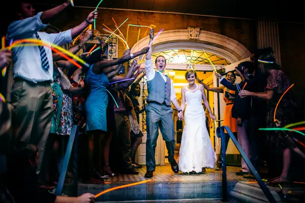 Bride and groom wedding send-off with glow sticks.