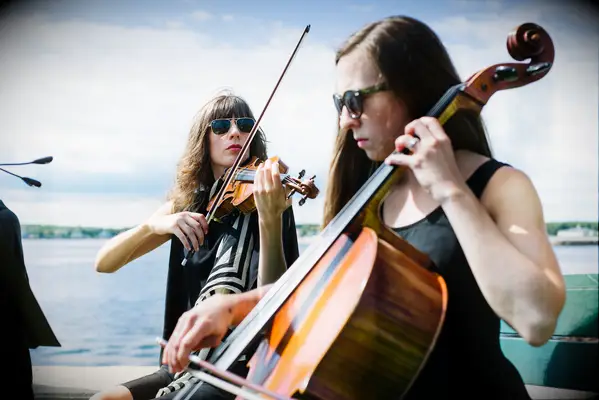 Violinist and Cellist playing at a wedding ceremony. 