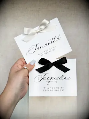 Bridesmaid invitation with sat bow tied in the center