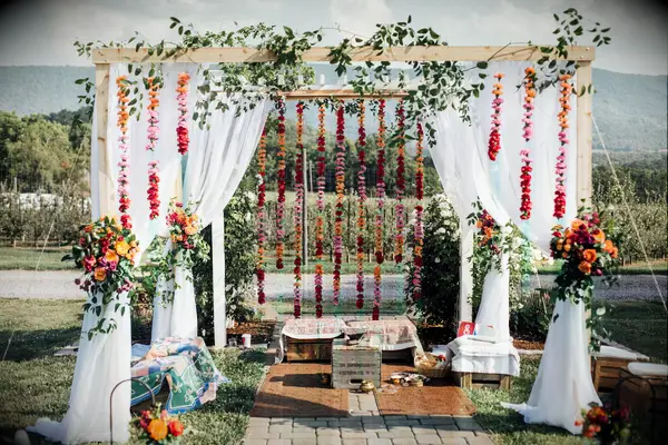 Rustic mandap with fabric draping and flower garlands