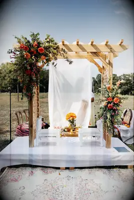 Wood pergola turned into rustic mandap with flowers
