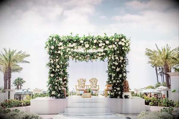 Dramatic mandap with lush greenery