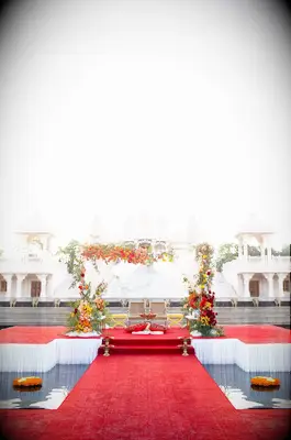 Glam mandap atop red stage
