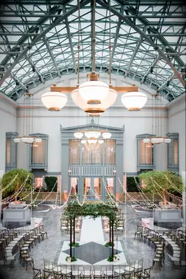 Mandap under twinkle lights in atrium wedding venue