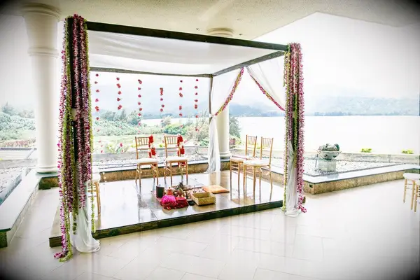 Simple mandap overlooking the water at a resort