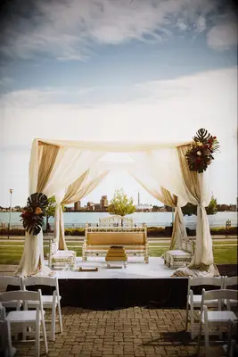 Beige mandap with Monstera leaf accents