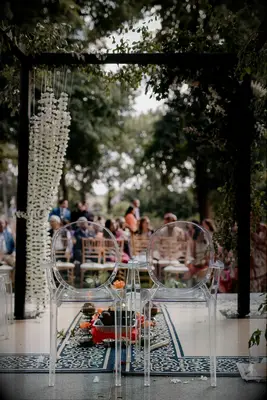 Boho mandap with ghost chairs