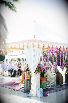 Tented mandap with purple orchid garlands