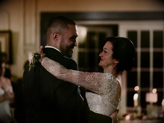 Groom dancing with mother during wedding reception