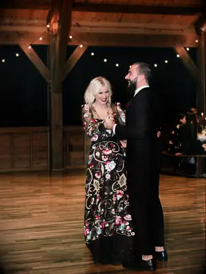 Edgy bride and groom dancing during first dance at wedding reception