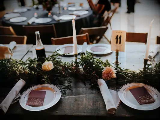 Lush green centerpieces at a fall wedding