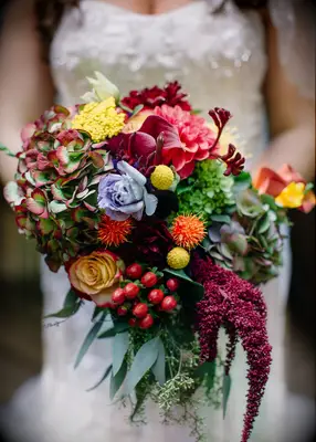 Burgundy flower bouquet at a fall wedding