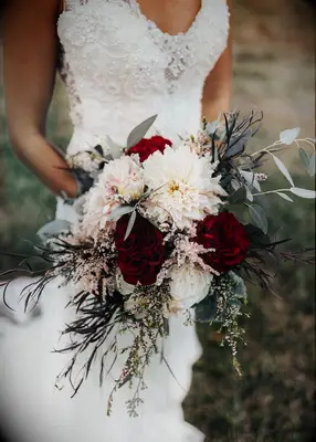 Dark and moody wedding bouquet at a fall wedding