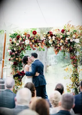 Floral wedding arch at a fall wedding