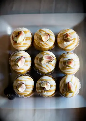 Elegant pumpkin and fig cupcakes at a fall wedding