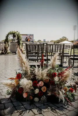 Pampas grass ceremony aisle arrangement