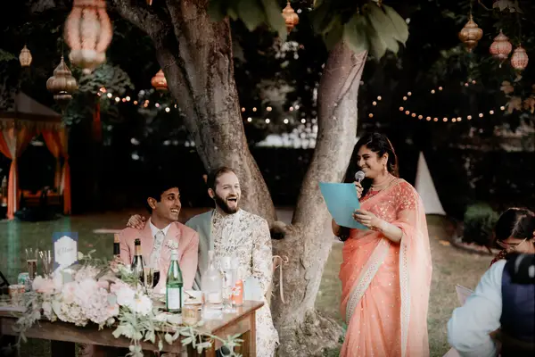 A friend gives a funny toast at a wedding. 
