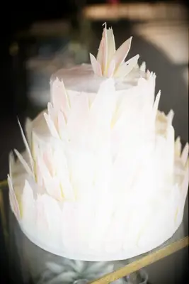 Three-tier modern wedding cake with brush stroke details