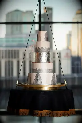 Silver and white art deco tiered wedding cake