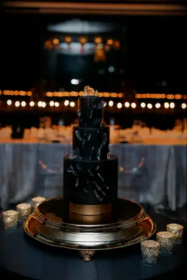 Three-tier modern black wedding cake with sugar shard decorations
