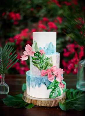 Tropical three-tier cake with painted decorations
