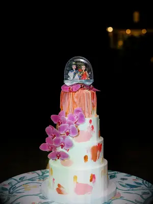 Snow globe wedding cake with pink orchids