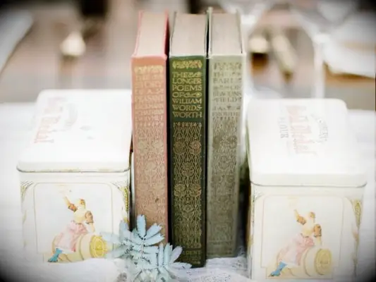 vintage books and tins as wedding centerpiece