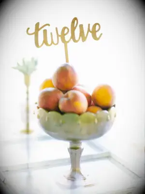 peach centerpiece with calligraphed table number