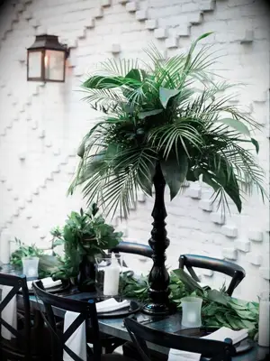 green-and-black leafy centerpiece