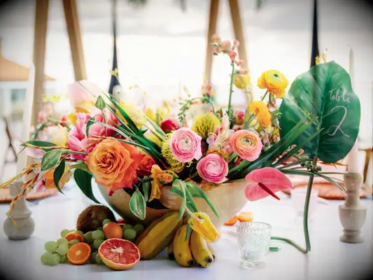 Tropical fruit flower wedding table arrangements