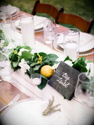 Lemon leaves citrus wedding table arrangements 