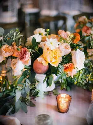 Peonies peaches wedding table arrangements fruit