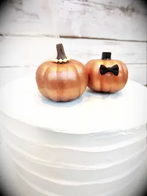 Comical Pumpkin Cake Toppers for a Spooky Wedding