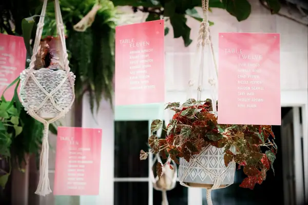 Hanging pink acrylic seating chart