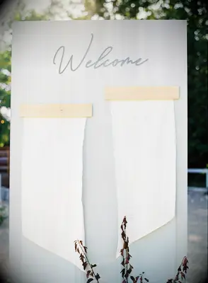 Linen seating chart mounted on wood board