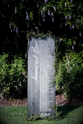 Wood seating chart with calligraphy