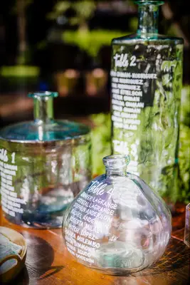 Glass bottle with calligraphy as seating chart