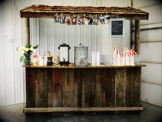 DIY rustic wood bar at casual wedding. 